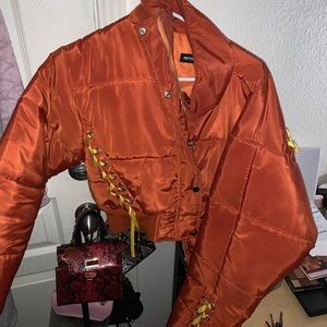 Orange jacket with yellow ribbons